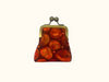 kisslock coin purse with abstract orange rock pattern and antique brass metal frame