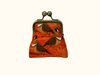 Coin purse with spinifex pigeons on an orange mottled background