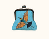 kisslock purse with rainbow bee eater design on a blue background