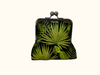 large kisslock coin purse featuring tropical leaves on a black background