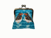 large kisslock coin purse with two zebra finches facing each other on a blue patterned background