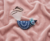Blue rooster felt brooch with black and white tail feathers
