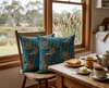 cushions featuring Australian wood ducks in water surrounded by bulrushes on a wooden chair at a breakfast table