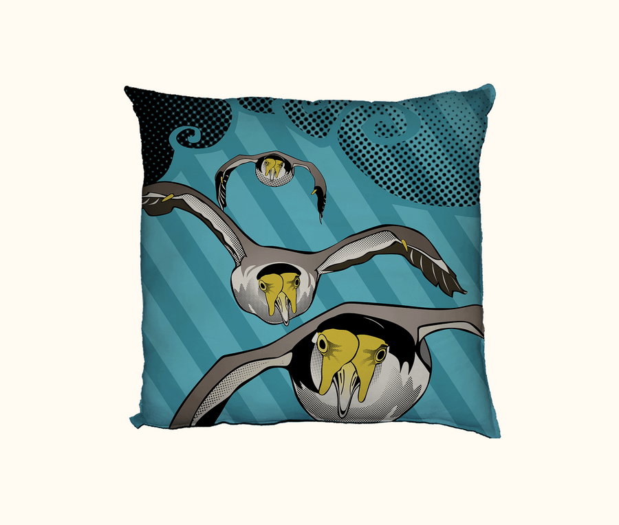cushion with pop art image of swooping plovers on a blue background