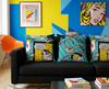 plover cushions on a black couch in a pop art styled lounge room