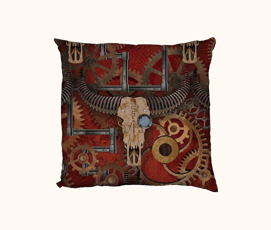 cushion cover with a large steampunk inspired buffalo skull against a background of cogs, pipes, circuits and red soil