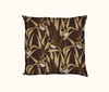cushion featuring chestnut-breasted mannikins on grass seedheads against a brown background