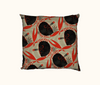 cushion printed with a flame-backed fiddler crab pattern in black and red-orange against a wavy beige background, with a mid-century modern feel