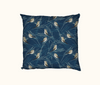 cushion with a pattern of double-barred finches on grasses on a blue background