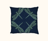 cushion with four large pale blue dragonflies against a dark blue swirly background