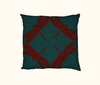 cushion with four large red dragonflies against a teal-green swirly background