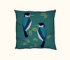 cushion with two stylised  forest kingfishers against a pattern of teal leaves