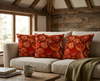 cushion with abstract red/orange/brown pattern reminiscent of rocks on a couoch in a rustic buidling