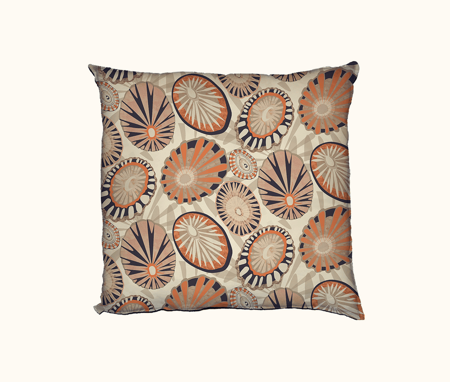 cushion featuring stylised limpet shells in browns, beige and an earthy orange tone