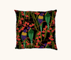 Cushion featuring rainbow lorikeets in a gum tree on a black background