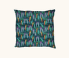 cushion with colorful fishing lure pattern on a blue-green background