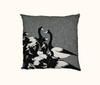 cushion with cluster of black and white magpie geese against a mottled background