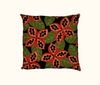 cushion with native peanut seedpods against a pattern of green leaves on a black background
