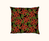cushion with native peanut seedpods against a pattern of green leaves on a black background