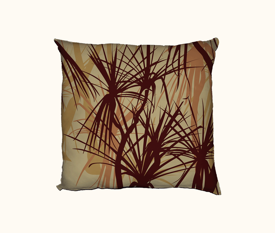 cushion with pandanus pattern in browns and terracotta tones