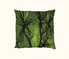 cushion with pattern of black pandanus on a green layered background