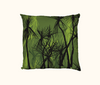 cushion with pattern of black pandanus on a green layered background