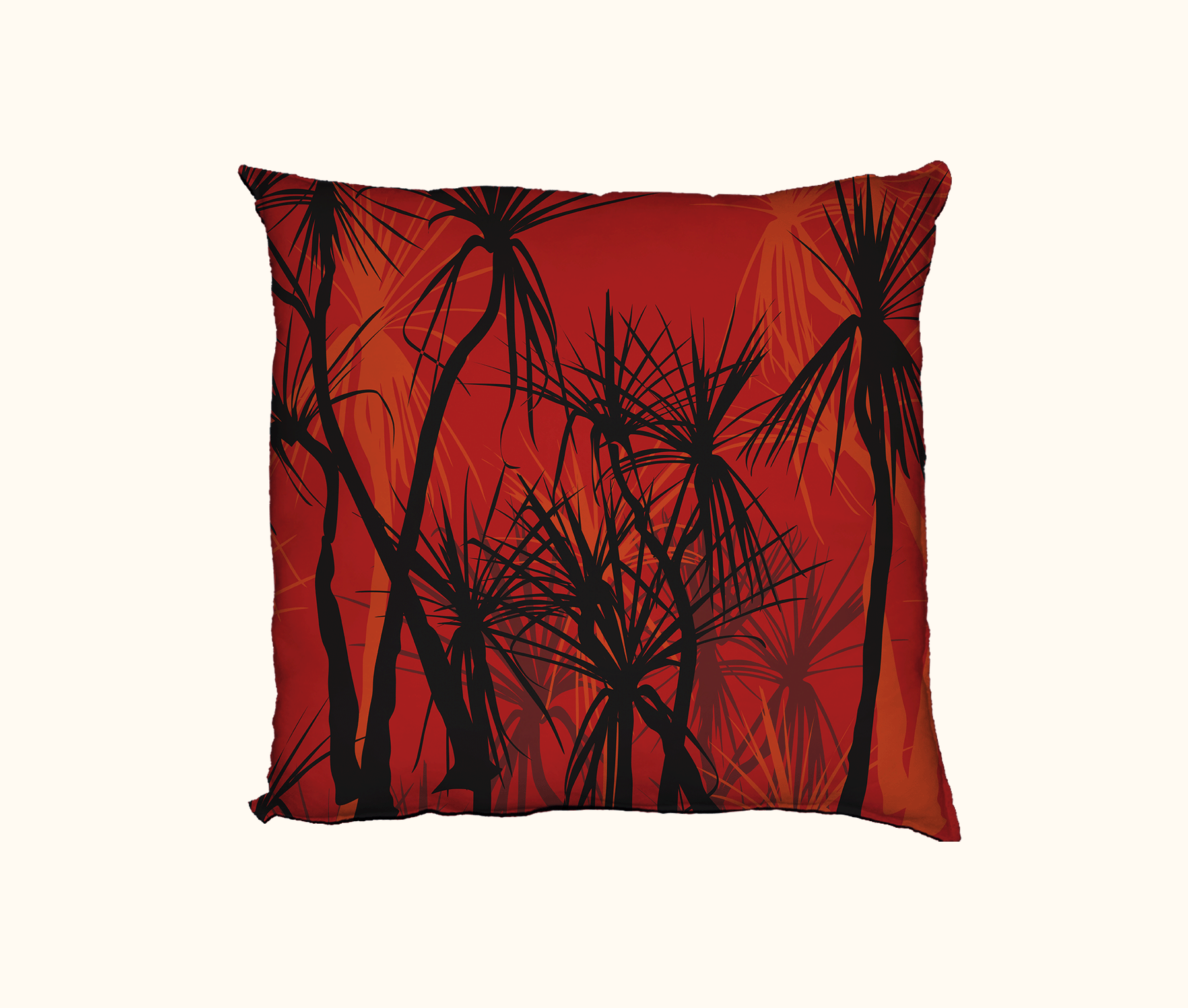 cushion with pattern of black pandanus on an orange layered background