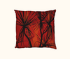 cushion with pattern of black pandanus on a orange layered background