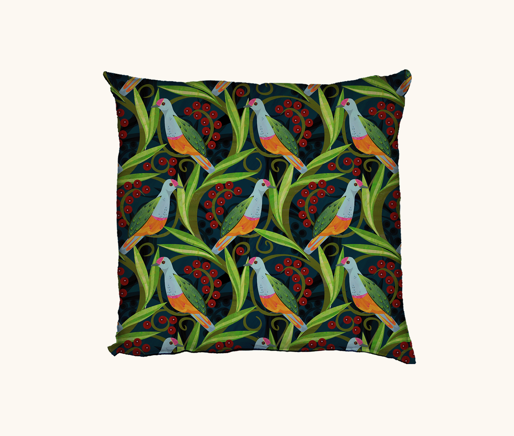 cushion with a pattern of rose-crowned fruit doves, leaves and berries on a dark blue background