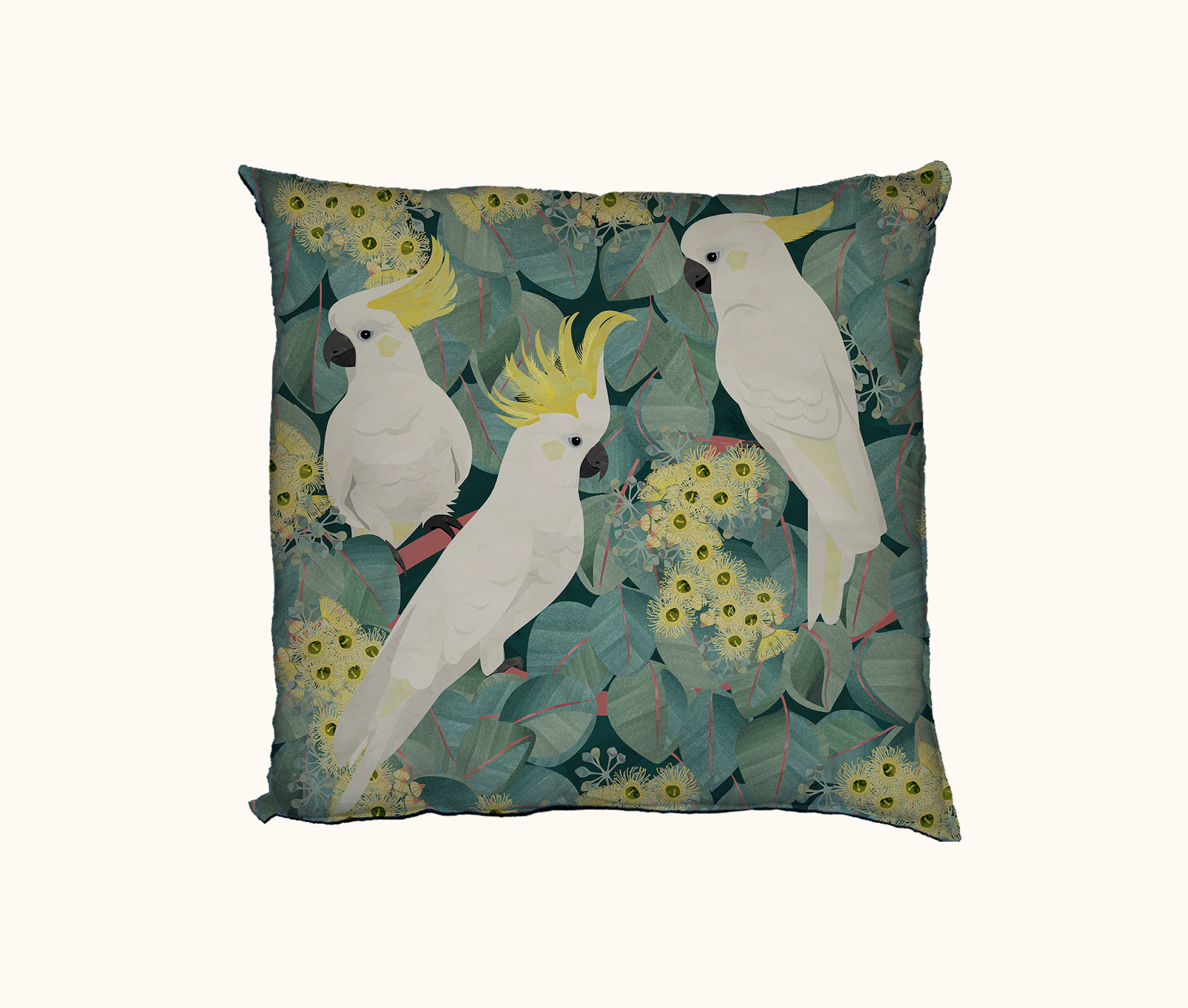 cushion featuring three sulphur crested cockatoos in a flowering red box tree