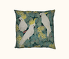cushion featuring three sulphur crested cockatoos in a flowering red box tree