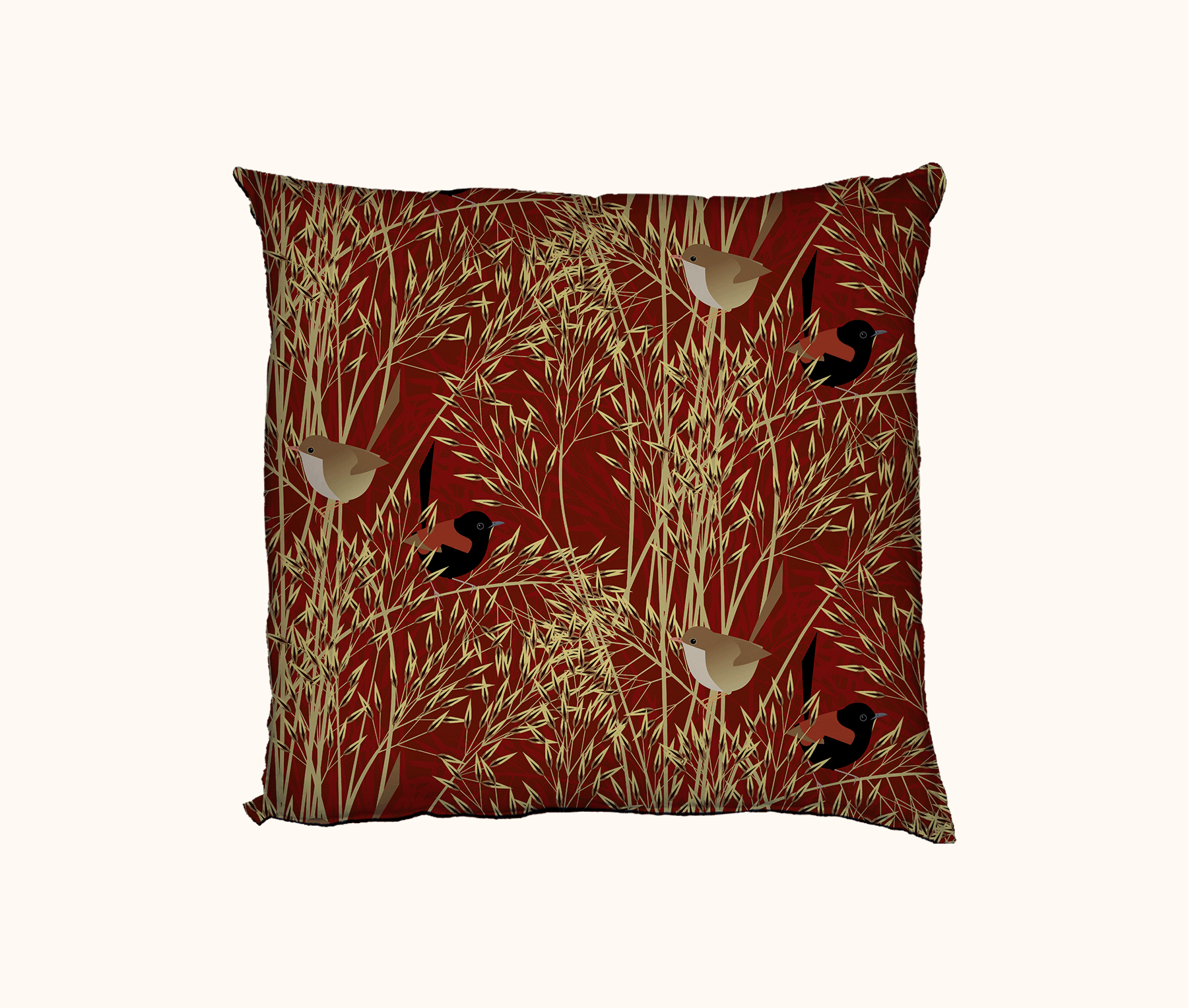 cushion patterned with stylised red-backed fairywrens on speargrass against a red background 