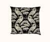 Cushion cover featuring black and cream pattern of royal spoonbills and sacred lotus leaves