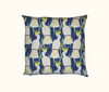 cushion with a pattern of stylised sulphur-crested cockatoos on a blue background