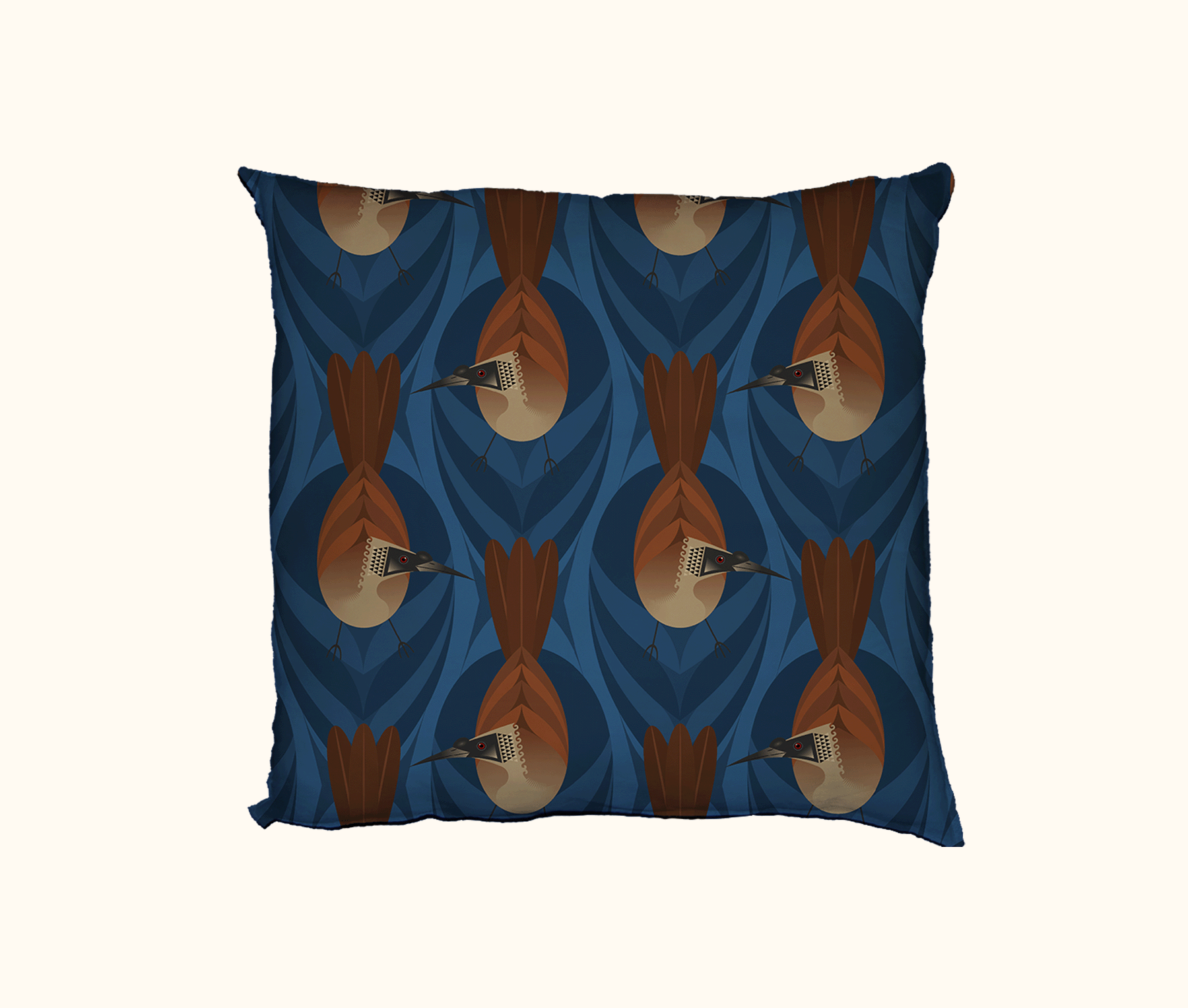 cushion featuring highly stylised silver-crowned friarbirds on a blue leaf-like pattern