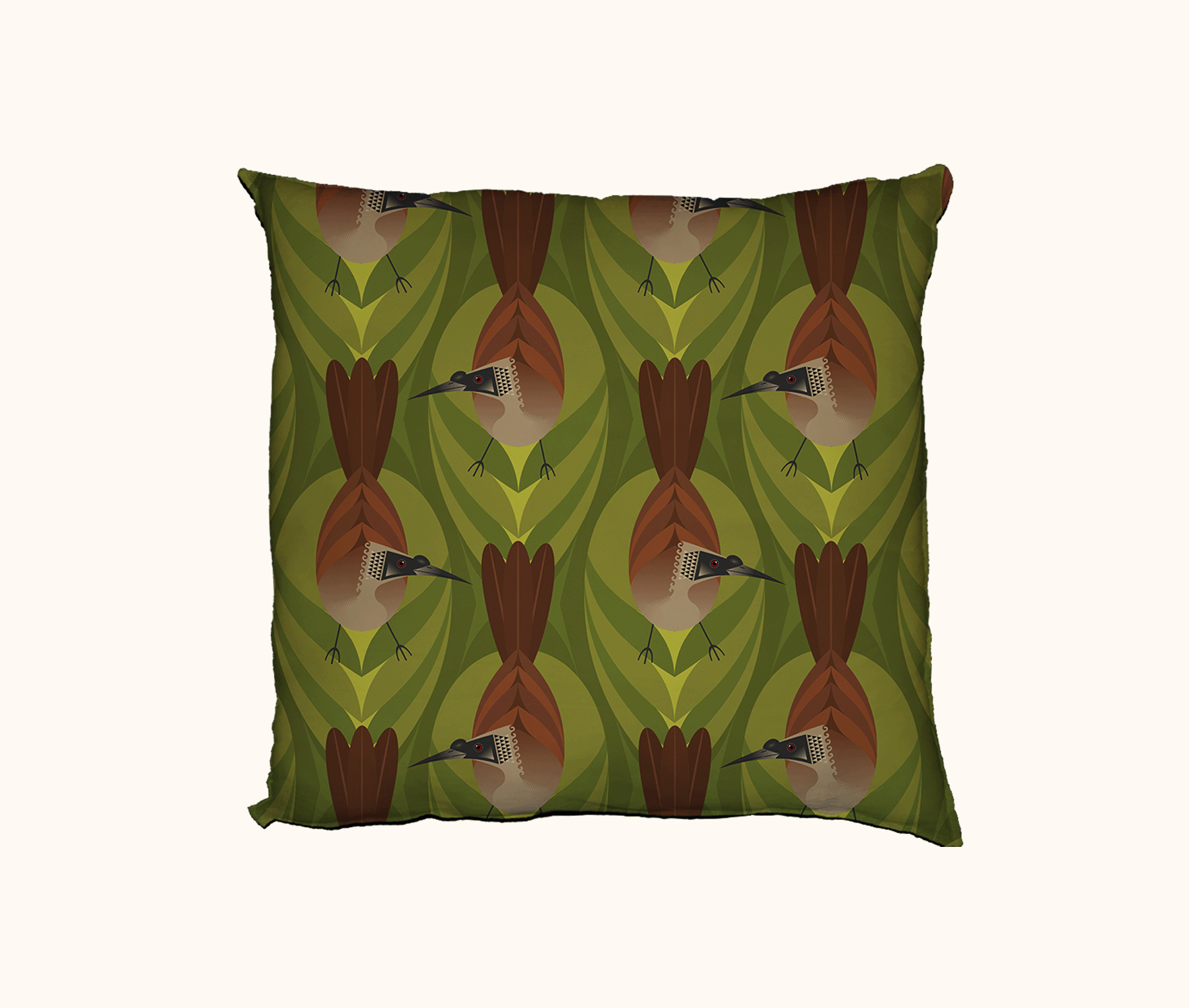 cushion featuring highly stylised silver-crowned friarbirds on a green leaf-like pattern