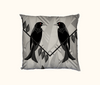 cushion featuring two spangled drongos facing each other on a grey and white background