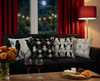 cushions from the spangled drongo range on a black couch