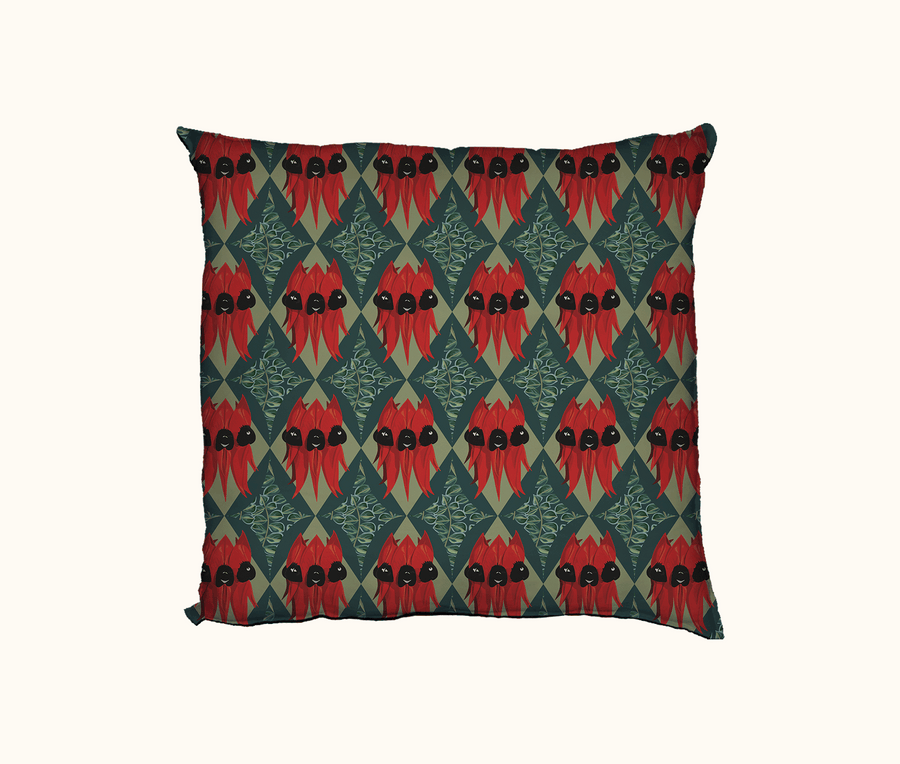 cushion featuring Sturt's desert pea on a geometric background of teal and green
