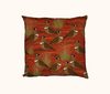 45cm square cushion featuring a pattern of spinifex pigeons and pigeons against an orange desert theme background