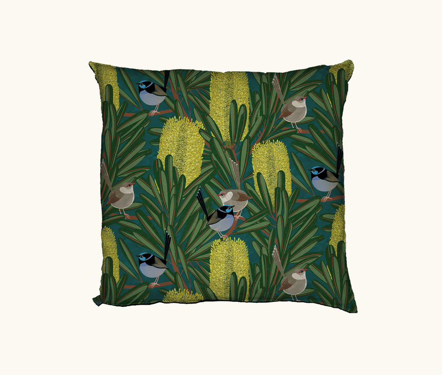 cushion with stylised repeat pattern of superb fairywrens in a flowering banksia marginata