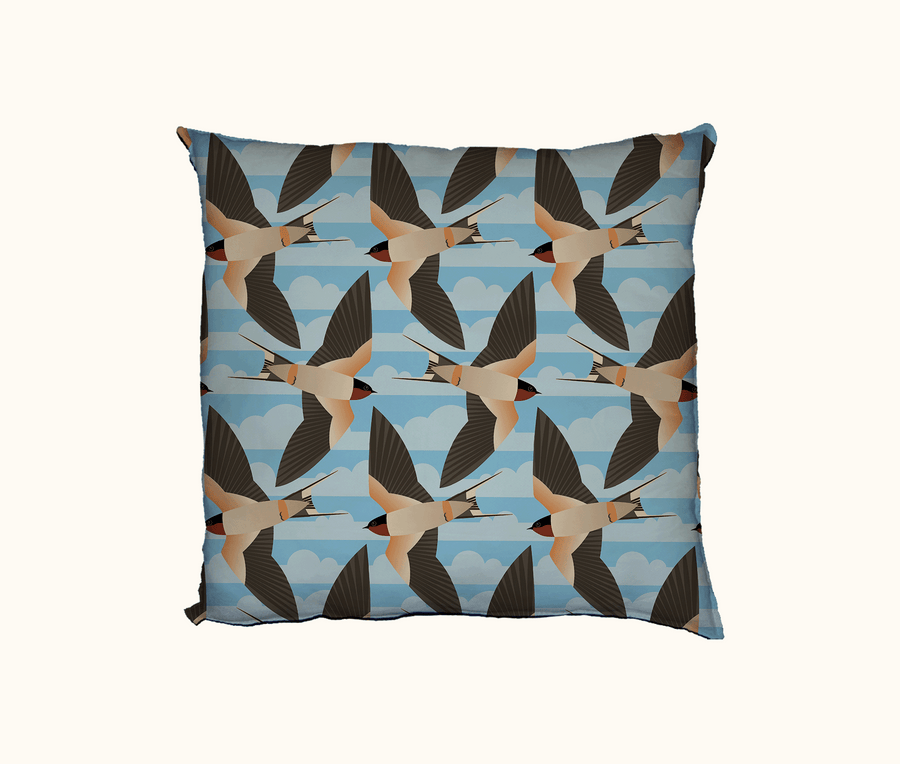 cushion with pattern of welcome swallows flying in different directions in rows, with a cloud pattern in the background