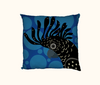 cushion with a stylised red-tailed black cockatoo head on a background of large blue spots