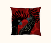 cushion with stylised red-tailed black cockatoo heads on a background of large red spots