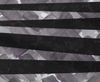 Irregular black stripes on a grey background of hatched brushstrokes