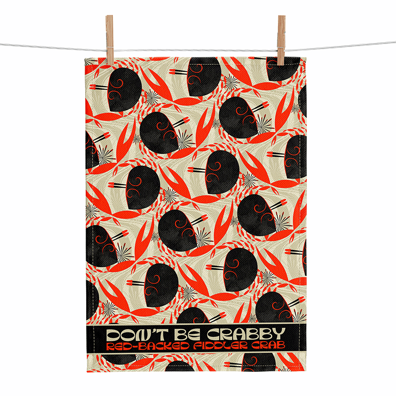 linen tea towel printed with a stylistic mid-century modern flame-backed fiddler crab pattern