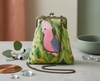 Evening bag printed with a galah in a gum tree, has a long antique brass chain