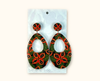 acrylic earrings with a native peanut seedpod and leaf pattern