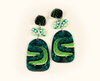 acrylic earrings featuring stylised saltwater crocodiles