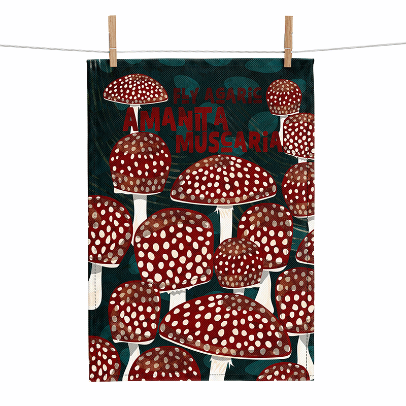 linen tea towel showing red and white spotted mushrooms